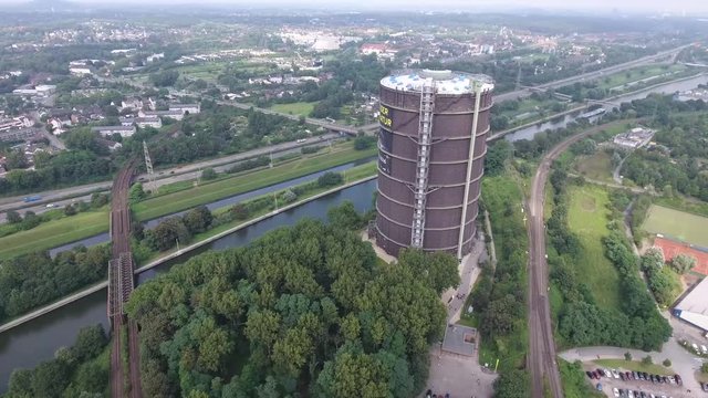 Old Historic Gasometer near River in Oberhausen Ruhr Vally Germany Aerial View 