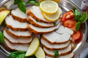 Plate with delicious sliced turkey fillet, closeup