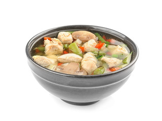 Bowl with delicious turkey soup on white background