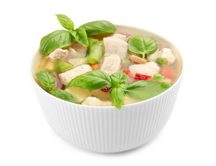 Bowl with delicious turkey soup on white background