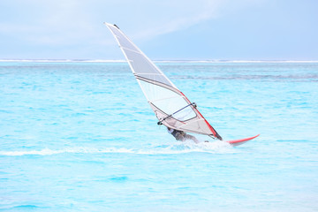 Man windsurfing at sea resort
