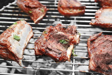 Cooking of appetizing juicy spare ribs outdoors