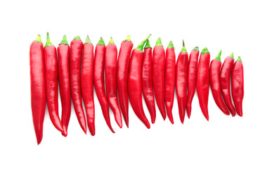 Horizontal row made of red chili peppers isolated on white