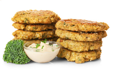 Broccoli pancakes served with sauce on white background