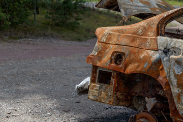 Burned rusty car