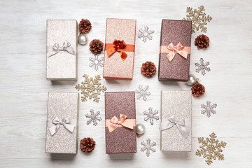 Gift boxes and Christmas decorations on wooden table