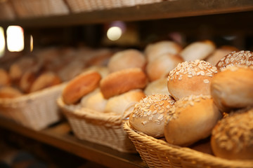 Different kinds of bakery products in baskets at buffet
