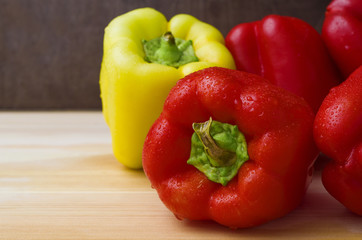 Fresh wet red and yellow paprika. Raw Red and Yellow Organic Bell Peppers. Ripe bell peppers closeup.