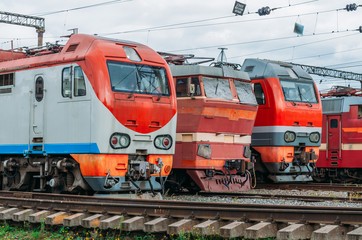 Fototapeta na wymiar Electric locomotives are lined up on the railway