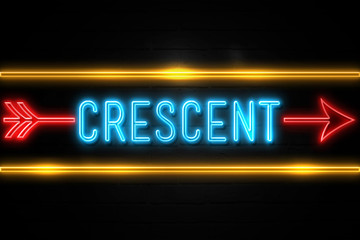 Crescent  - fluorescent Neon Sign on brickwall Front view