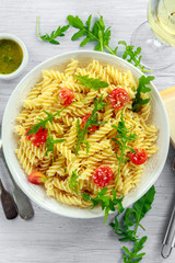 Lemon rocket rotini pasta salad with cherry tomatoes and parmesan cheese
