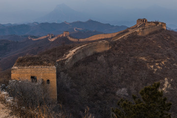Sunrise at the Great Wall of China. The Great Wall of China is the world's longest wall and biggest ancient architecture