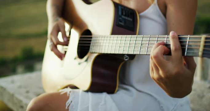 Woman Playing Guitar