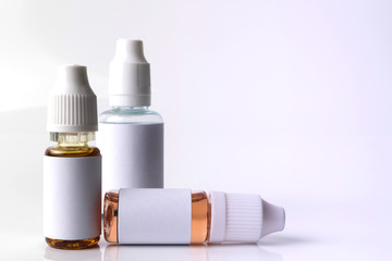 Isolated e liquid bottles for vape devices on a white background