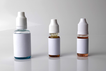 Isolated e liquid bottles for vape devices on a white background