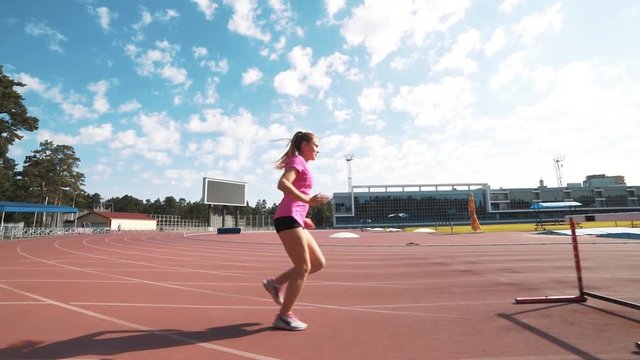 Professional female hurdler during training