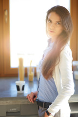 happy woman drinking tea in the kitchen at home. Woman at home