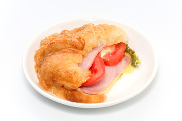 croissant ham and cheese on plate