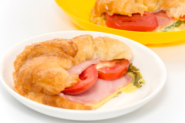 croissant ham and cheese on plate