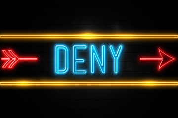 Obraz premium Deny - fluorescent Neon Sign on brickwall Front view