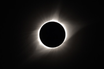 The sun's corona appears behind the moon as the sun is totally eclipsed by the moon during the 2017 total solar eclipse