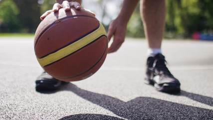 Close up of basketball player dribbling the ball