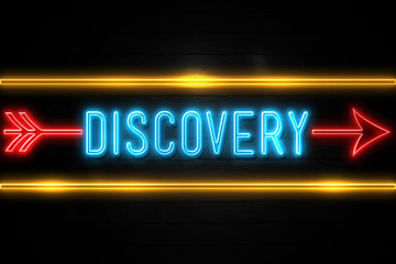 Discovery  - fluorescent Neon Sign on brickwall Front view