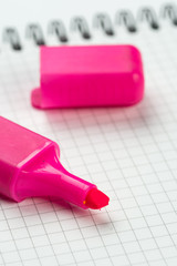 Felt pen on the school notebook with copy space above white background