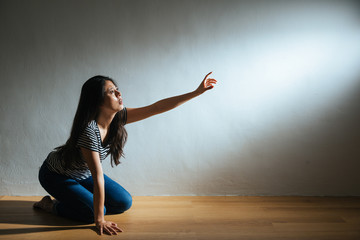 depression lady kneeling on wooden floor ground