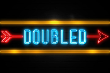 Doubled  - fluorescent Neon Sign on brickwall Front view