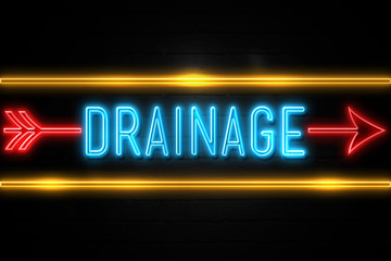 Drainage  - fluorescent Neon Sign on brickwall Front view