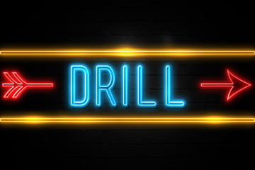 Drill  - fluorescent Neon Sign on brickwall Front view