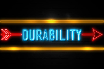 Durability  - fluorescent Neon Sign on brickwall Front view