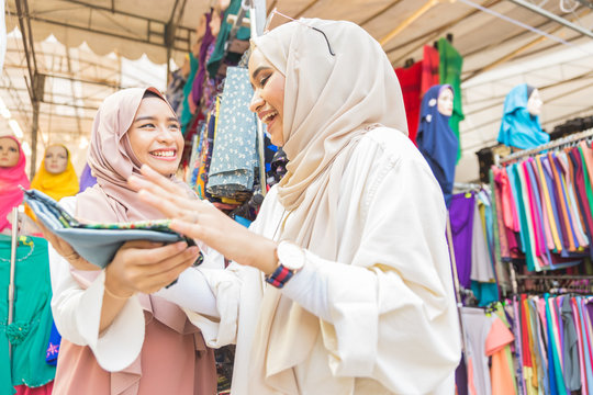 Two Muslim women at a Hari Raya Bazaar in Singapore