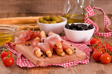 Grissini breadsticks with ham. 
