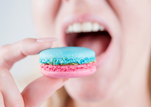 girl bites macarons