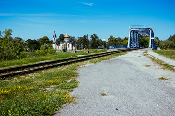 Fototapeta premium Bolderaja Bridge and Orthodox Church on the other side Bolderaja, Riga, Latvia