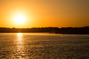 golden sunset on a river in the nature