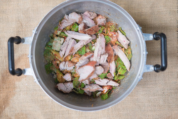 Cooking slide grilled pork salad in pot