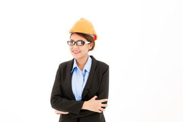 Young attractive confident asian woman, orange safety hat, glass, black suit, blue shirt on white background with arm cross.