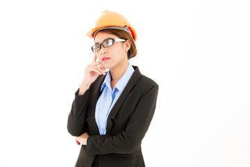 Young attractive confident asian woman thinking, orange safety hat, glass, black suit, blue shirt on white background.