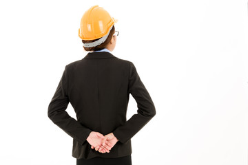 Young attractive confident asian woman, orange safety hat, safety glass, black suit, blue shirt on white background with arm cross.