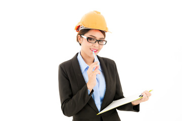 Young attractive confident asian woman, orange safety hat, glass, black suit, blue shirt on white background writing on notepad