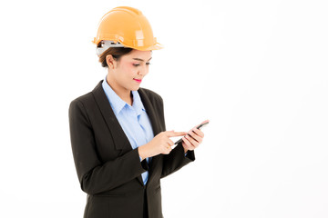 Young confident asian woman, orange safety hat, black suit, blue shirt on white using smart  phone device.