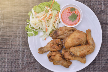 Top View Fresh fried chicken on a white plate , light effect. 