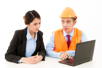 Young Asian male engineer talking to female business woman on white background.