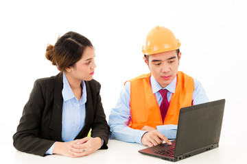 Young Asian male engineer talking to female business woman on white background.