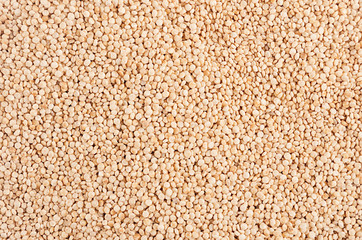 Quinoa groats background. Top view, closeup.