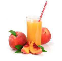 Glass of fruit juice with straw and cut peaches isolated on white background