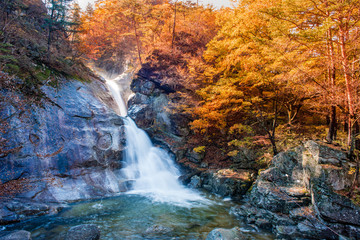 Fototapeta na wymiar Guryong Falls in the fall foliage.